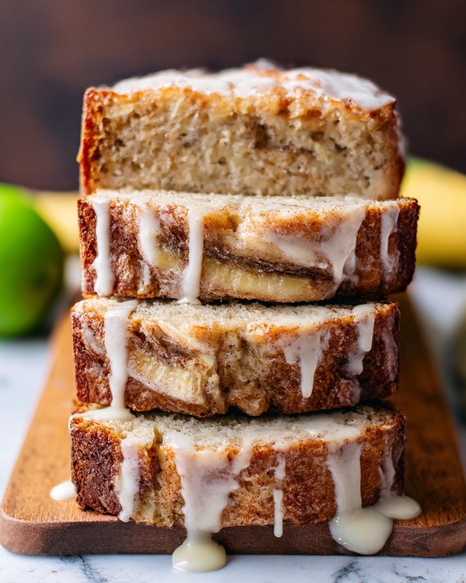A loaf of banana bread is shown sliced into four thick pieces, stacked slightly unevenly on a wooden board. Each slice reveals a soft, moist interior with visible chunks of banana and streaks of cinnamon sugar swirled throughout. The top crust is golden brown with a slightly crispy texture, drizzled generously with a thick, white glaze that drips down the sides and pools at the base. The background features a blurred green fruit and a subtle dark tone, while the board rests on a white marbled surface. Photo taken with an iphone --ar 4:5 --v 7